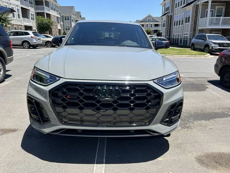 Premium mobile car detailing in Raleigh, NC: Front of a gray Audi SQ5 with a gloss black grille and clear LED headlights