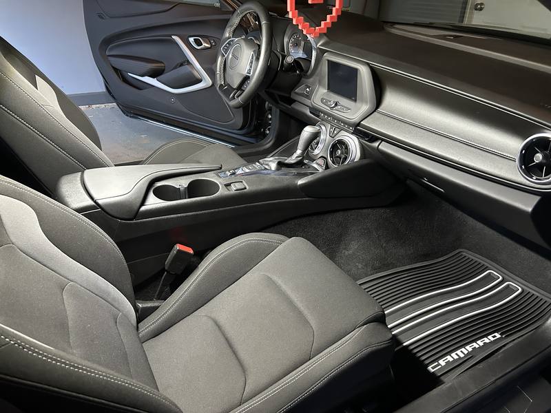 Mobile car detailing in Monroe, NC: Chevy Camaro passenger seat, center console, and floor mat after an interior detail