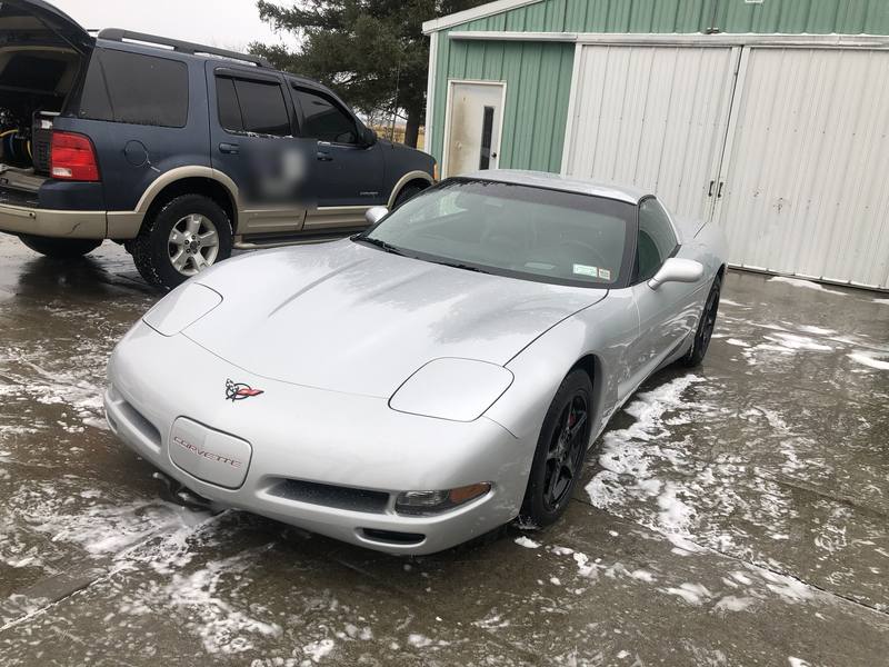 Mobile car detailing in Mooresville, NC: Silver C5 Corvette after a hand wash, parked next to a mobile detailing SUV