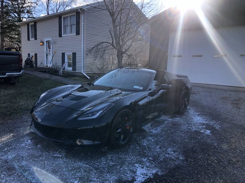 Mobile car detailing in Mint Hill, NC: Black C7 Corvette Stingray parked in a gravel driveway after a detail