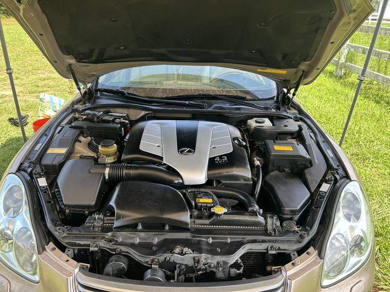 Mobile engine bay cleaning in Charlotte, NC: Lexus SC430 engine bay with a clean V8 cover and dressed plastics