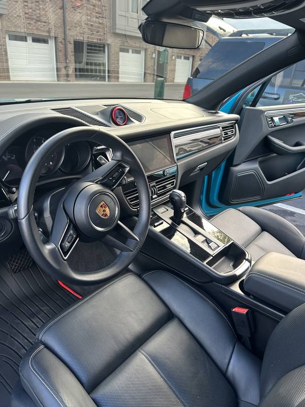 Mobile car detailing in Mint Hill, NC: Porsche Macan black leather seats and dashboard after an interior detail