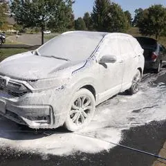 Premium mobile car detailing in Raleigh, NC: Honda CR-V covered in foam during a hand car wash