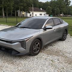 Mobile car detailing in Charlotte, NC: Gray Kia K4 sedan with dark tinted windows