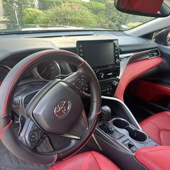Mobile car detailing in Charlotte, NC: Toyota Camry red leather dash and console wiped down and clean