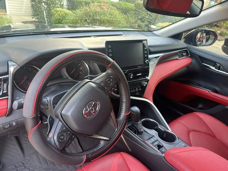 Mobile car detailing in Tega Cay, SC: Toyota Camry dashboard, steering wheel, and center console after an interior detail